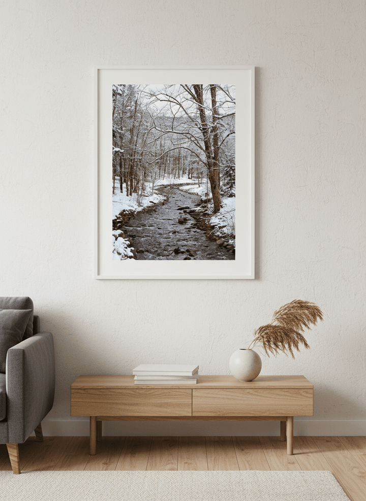 Modern wall art styled above a sofa in a neutral living room