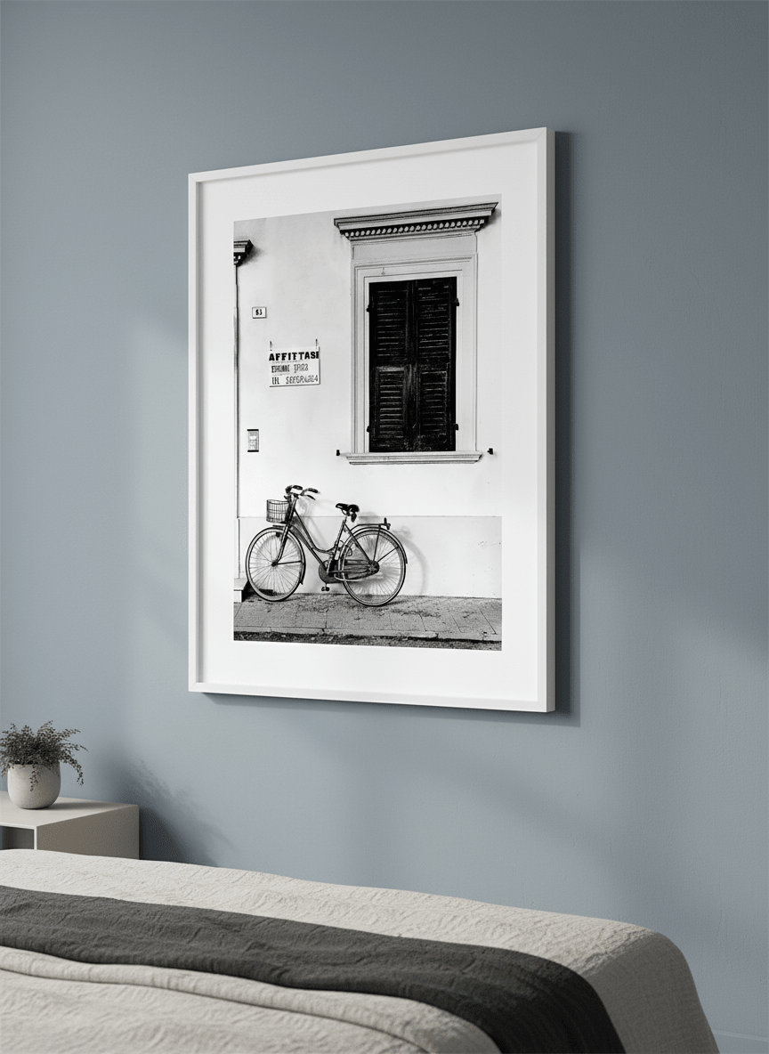 Minimalist artwork displayed in a calm, light-filled bedroom interior