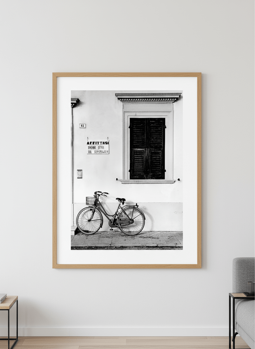 Modern wall art styled above a sofa in a neutral living room