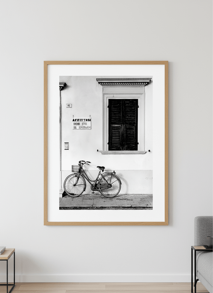 Modern wall art styled above a sofa in a neutral living room