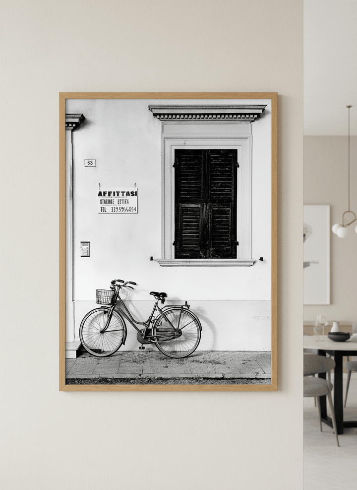 Wall art styled above a dining table in a contemporary home