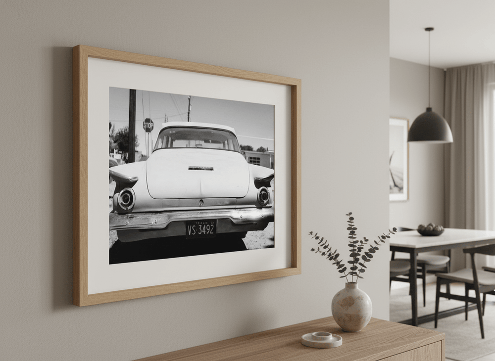 Wall art styled above a dining table in a contemporary home