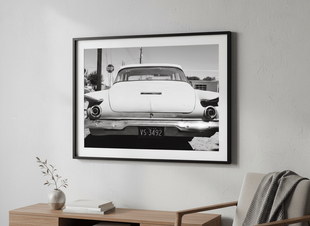 Modern wall art styled above a sofa in a neutral living room