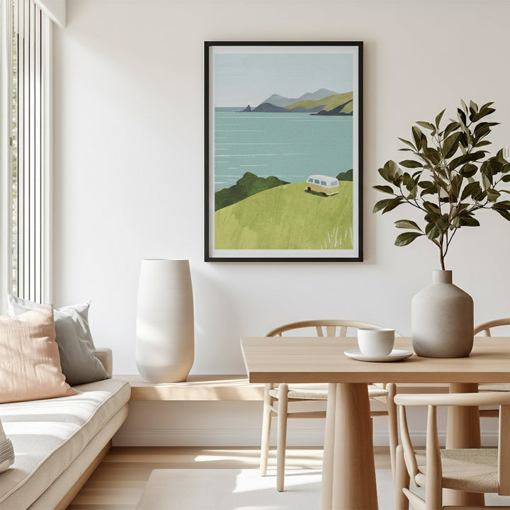 Artwork of a scenic landscape with a van on a wall in a living room.