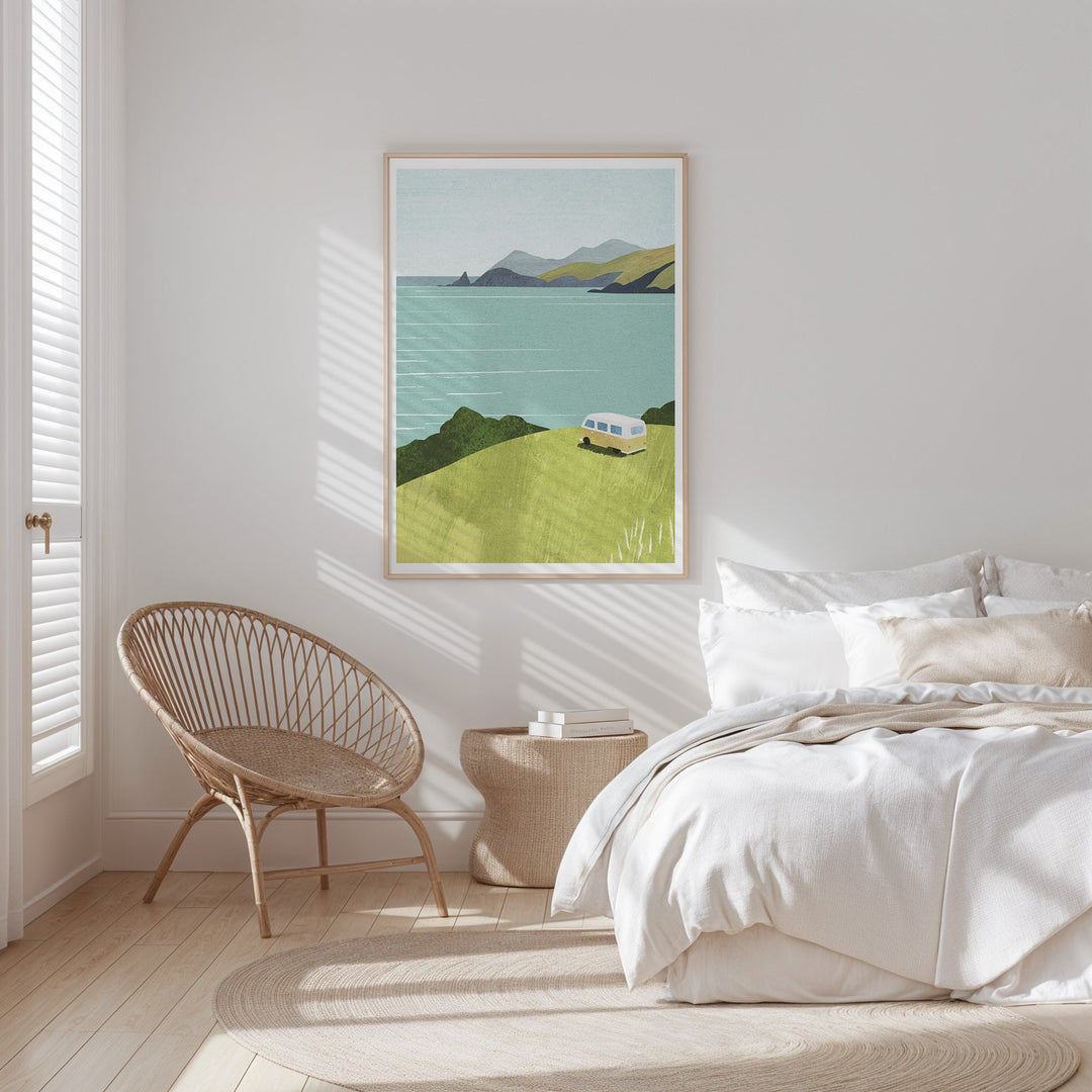 Modern bedroom with a bed, chair, and landscape art on the wall.