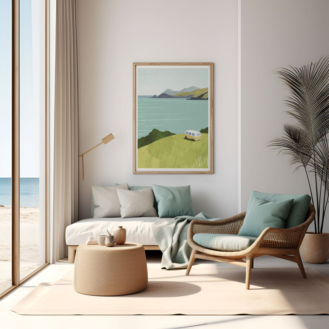 Modern living room with a sofa, armchair, and artwork of a beach scene.