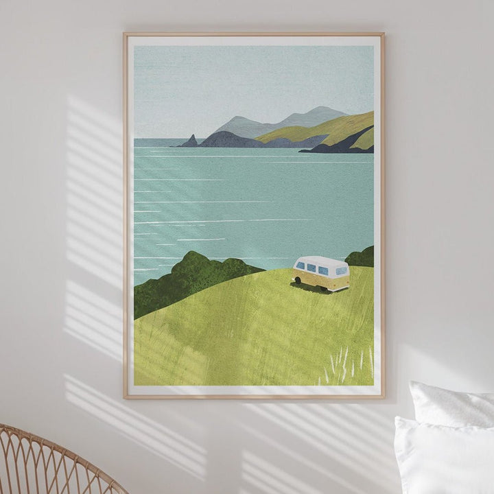 Modern bedroom with a bed, chair, and  landscape art on the wall.