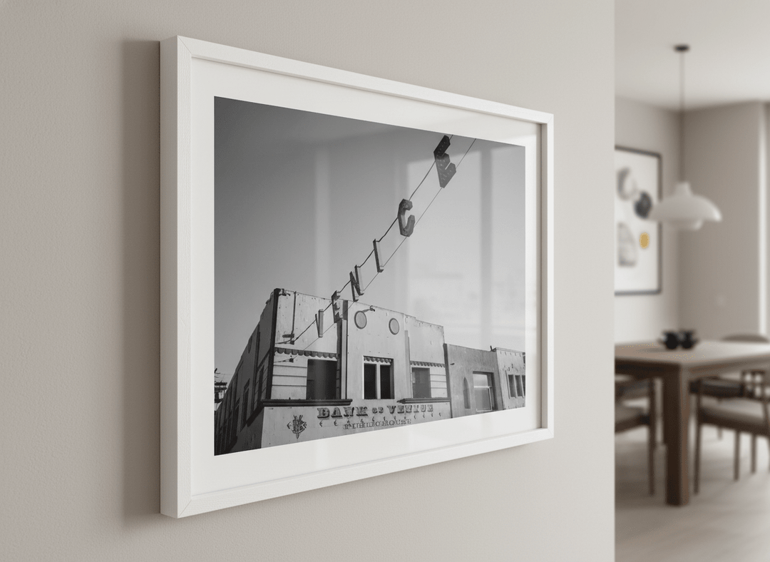 Wall art styled above a dining table in a contemporary home