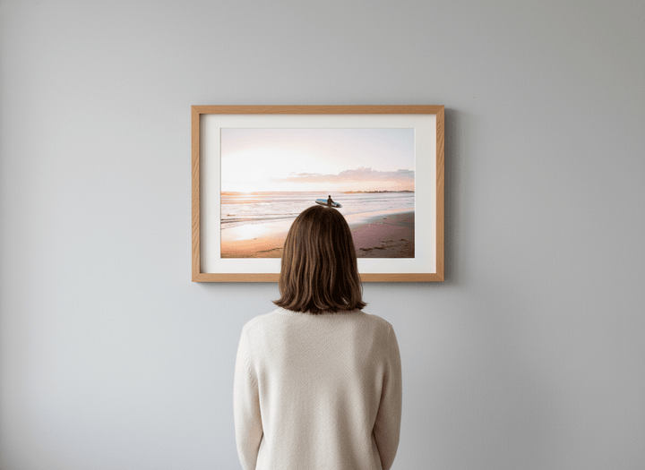 Person showcasing the artwork against a clean modern interior wall