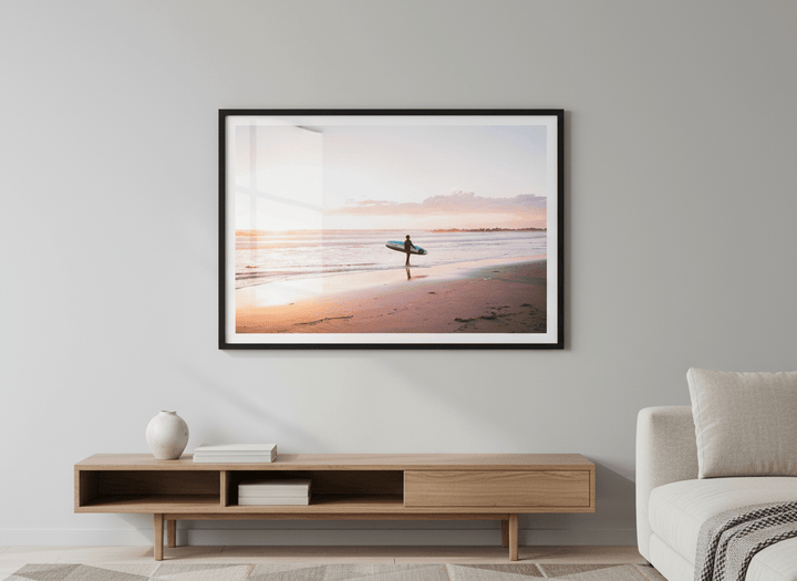 Modern wall art styled above a sofa in a neutral living room