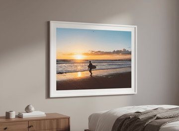 Minimalist artwork displayed in a calm, light-filled bedroom interior