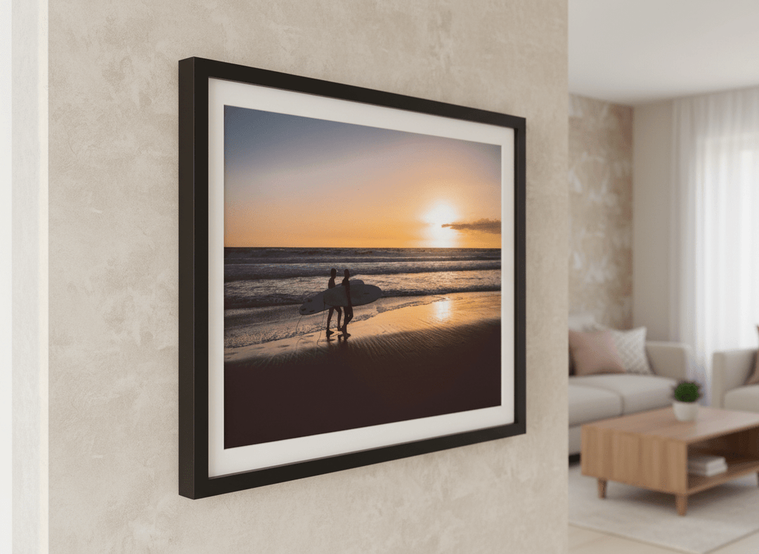 Modern wall art styled above a sofa in a neutral living room