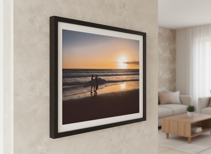Modern wall art styled above a sofa in a neutral living room