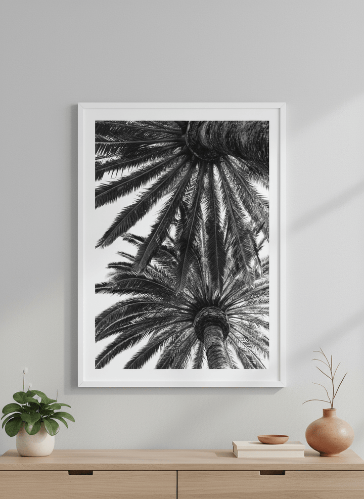 Minimalist artwork displayed in a calm, light-filled bedroom interior