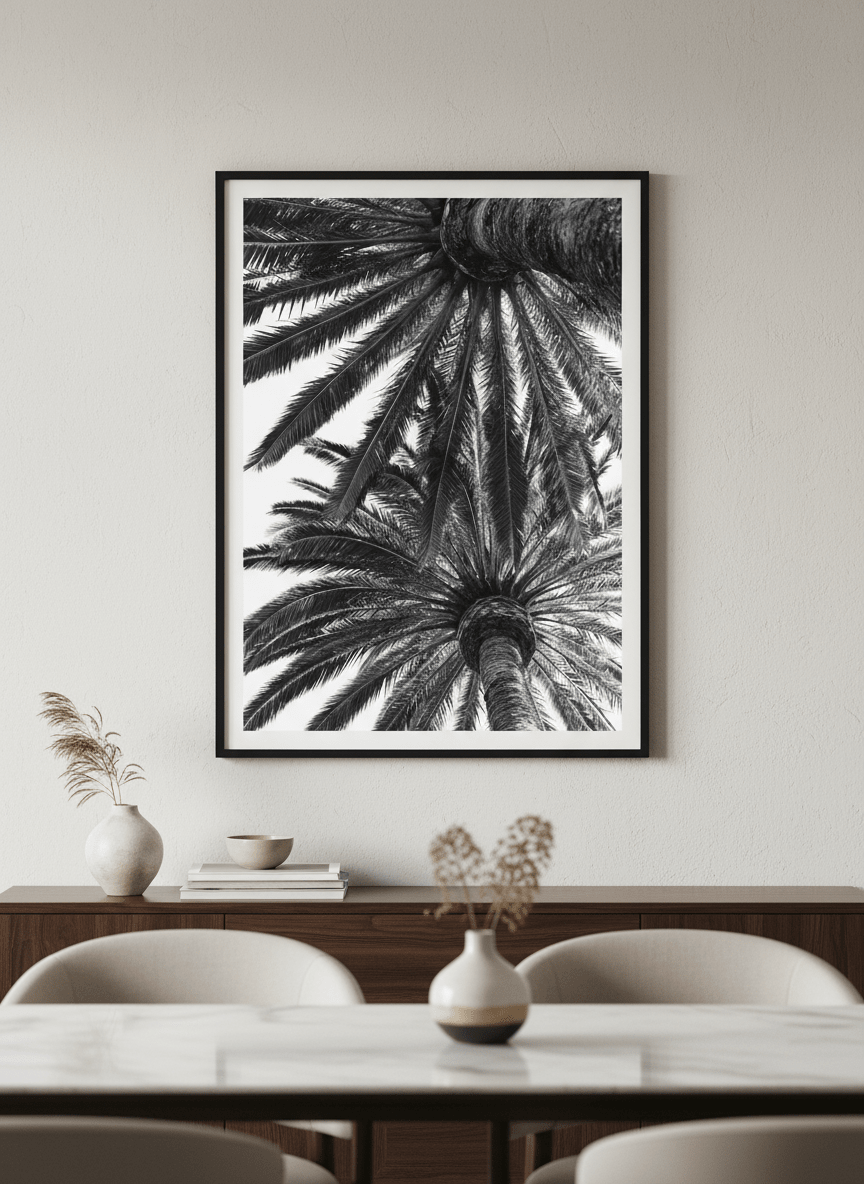 Wall art styled above a dining table in a contemporary home