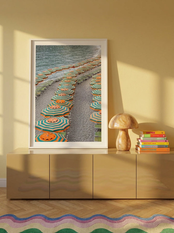 Modern wall art print standing on a sideboard in a colourful eclectic dining room