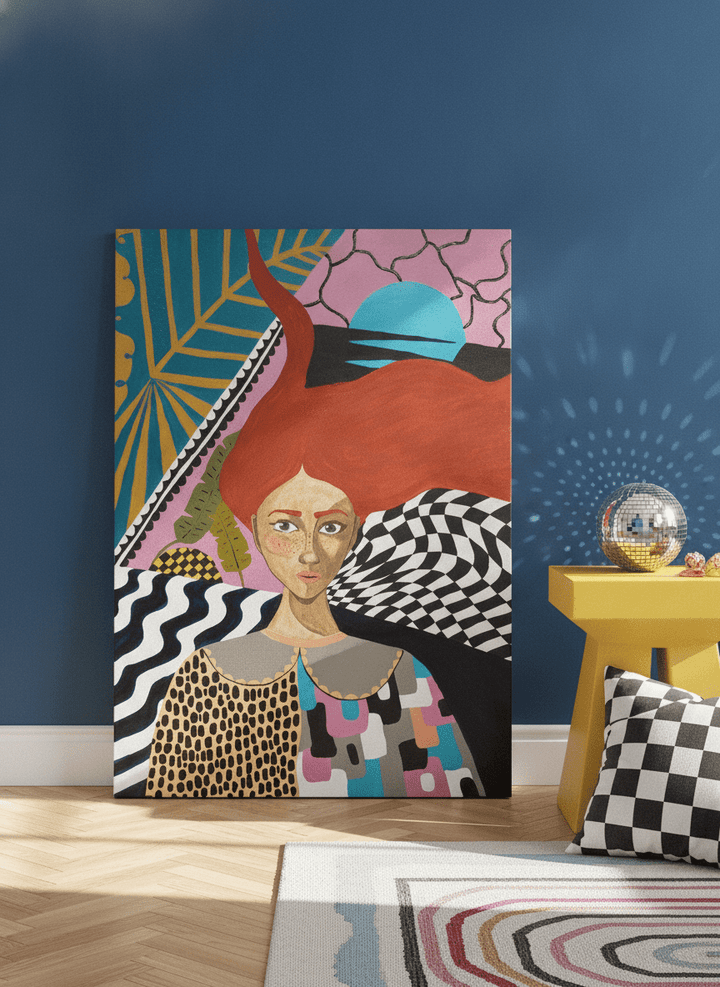 Stretched canvas wall art leaning against the wall in a colourful eclectic bedroom