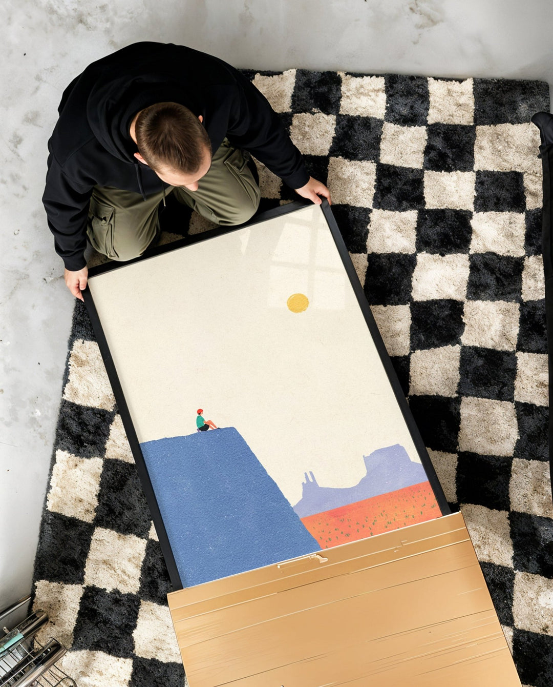 Person setting up a colorful board game on a checkered rug