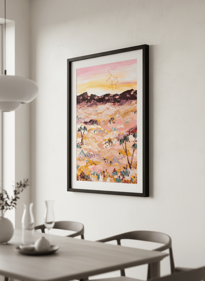Wall art styled above a dining table in a contemporary home