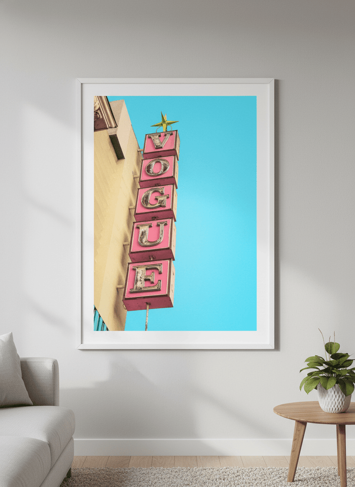 Modern wall art styled above a sofa in a neutral living room