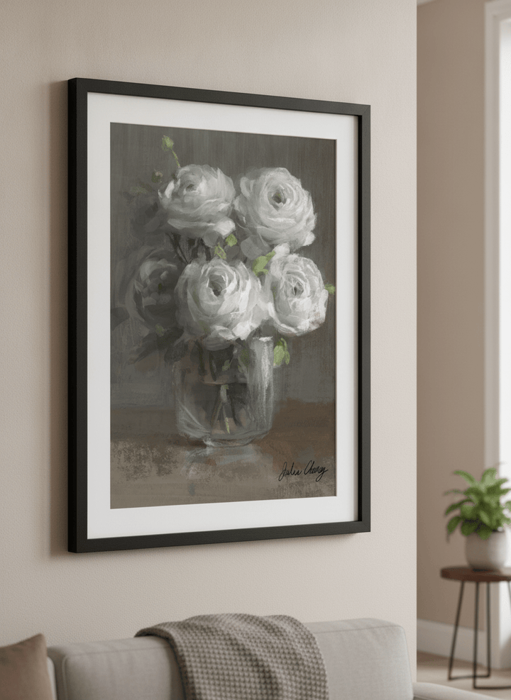 Modern wall art styled above a sofa in a neutral living room