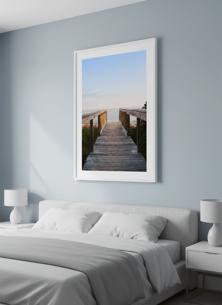 Minimalist artwork displayed in a calm, light-filled bedroom interior