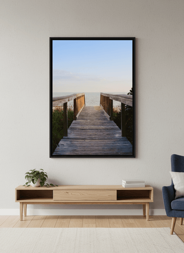 Modern wall art styled above a sofa in a neutral living room