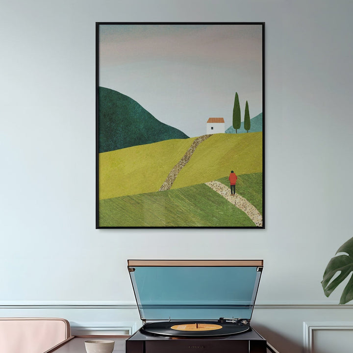 Wooden side table with record player, artwork on wall, and plant in room.