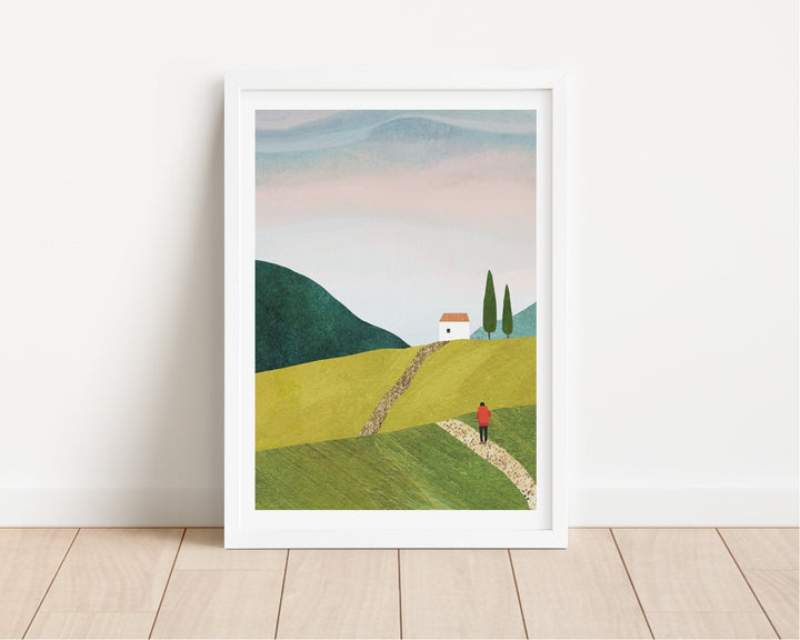 Artwork of a landscape with a house and person on a path, on a white wall.