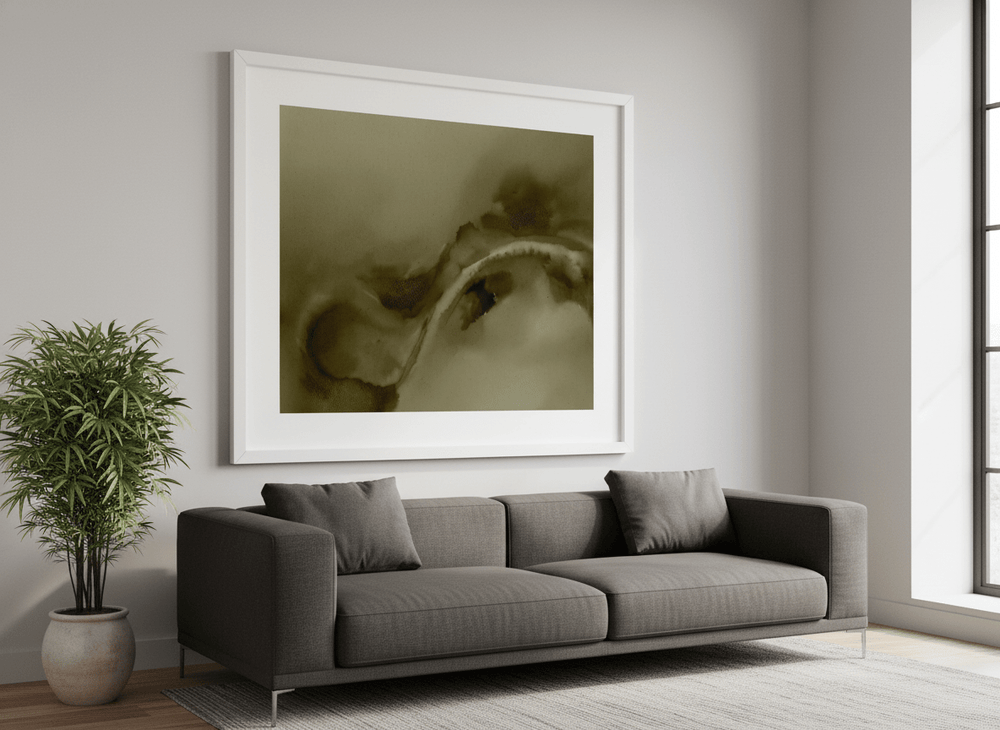 Modern wall art styled above a sofa in a neutral living room