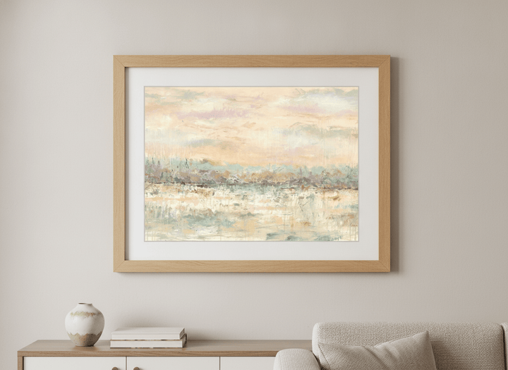 Modern wall art styled above a sofa in a neutral living room