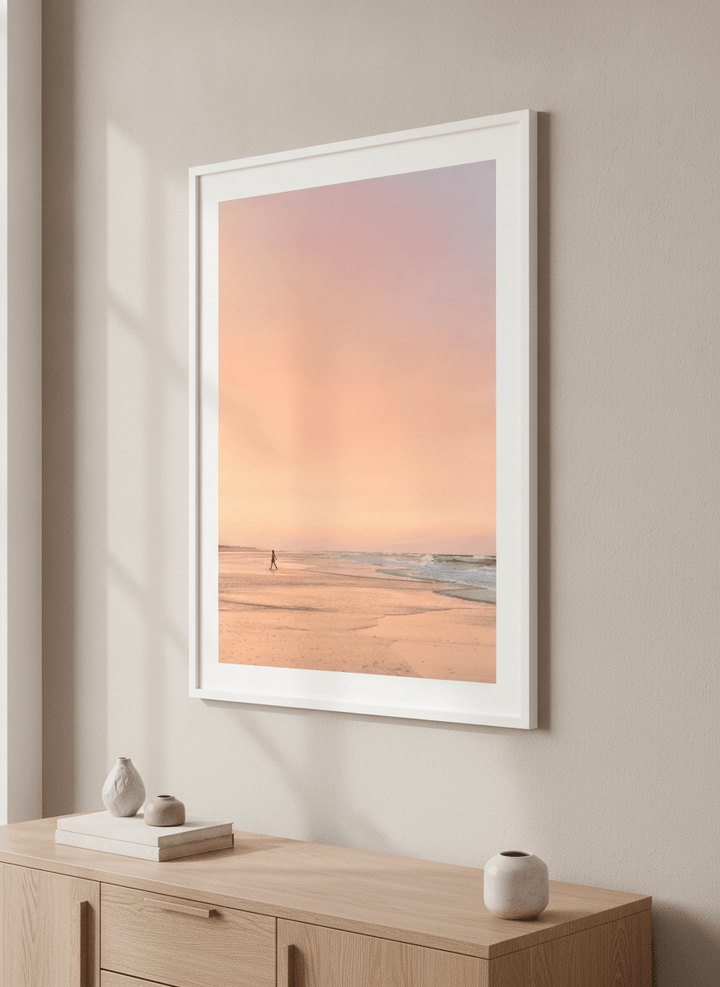 Modern wall art styled above a sofa in a neutral living room