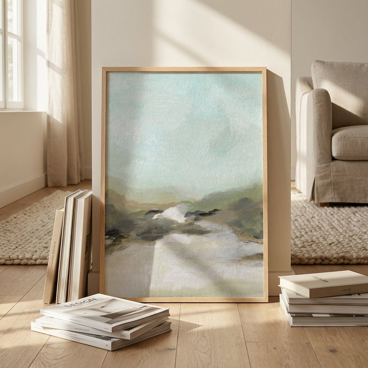 abstract artwork on a wooden floor with books and a sofa in the background