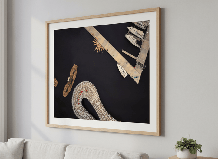 Modern wall art styled above a sofa in a neutral living room