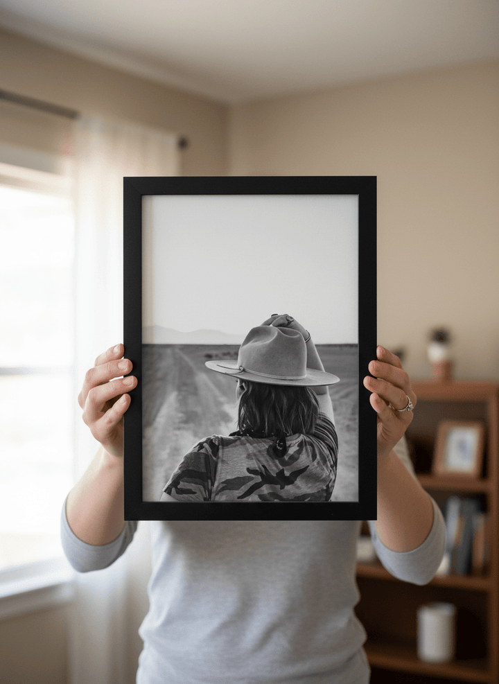 Person showcasing the artwork against a clean modern interior wall