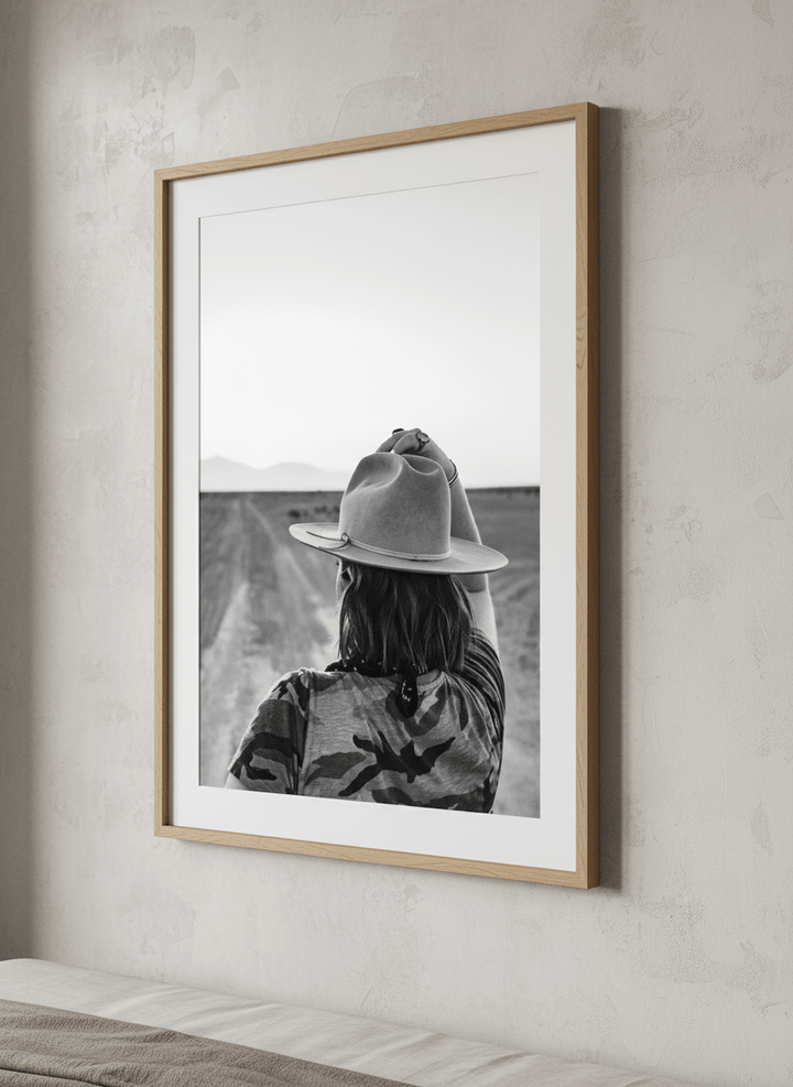 Minimalist artwork displayed in a calm, light-filled bedroom interior