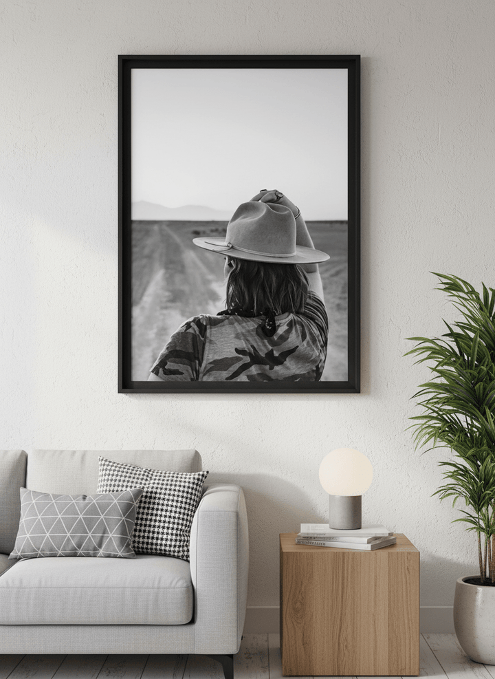 Modern wall art styled above a sofa in a neutral living room
