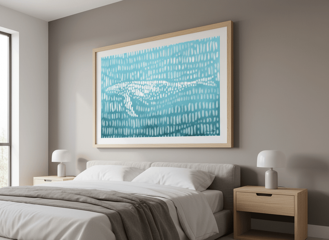 Minimalist artwork displayed in a calm, light-filled bedroom interior