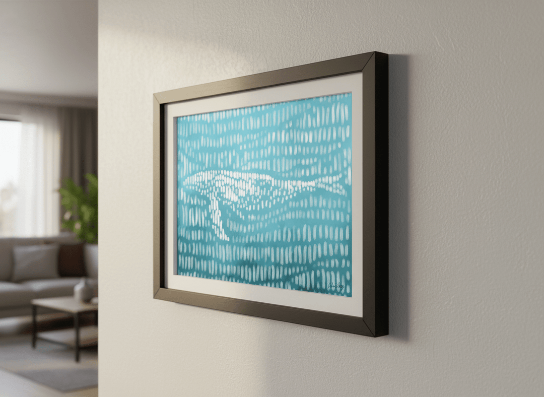 Modern wall art styled above a sofa in a neutral living room