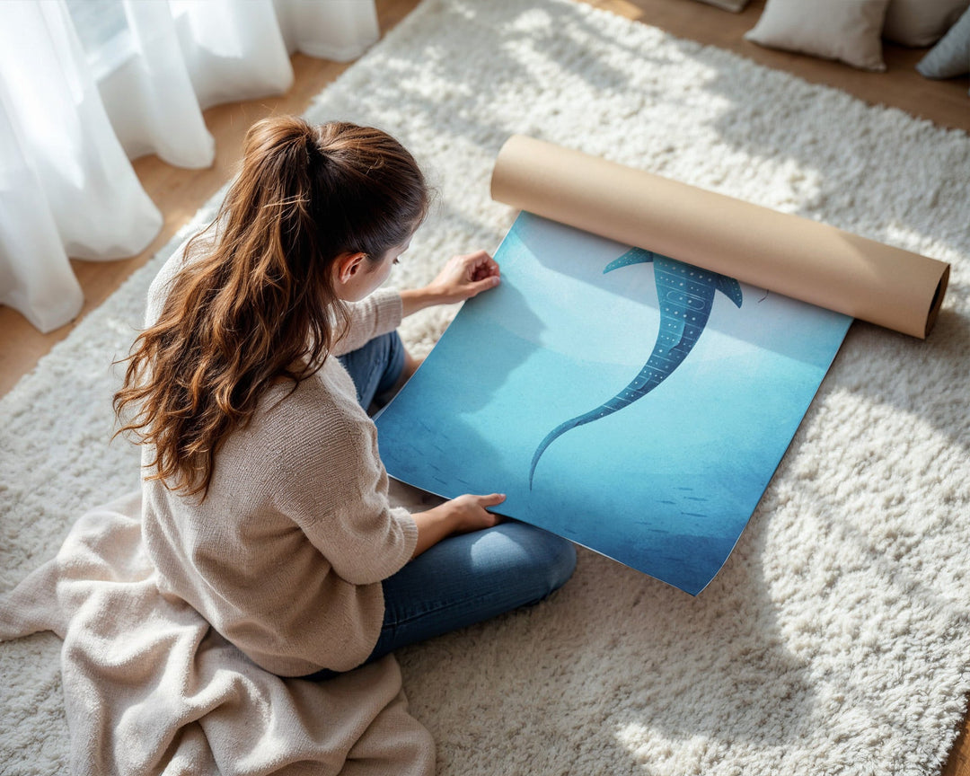 Woman unrolling a blue poster on a light-colored carpet