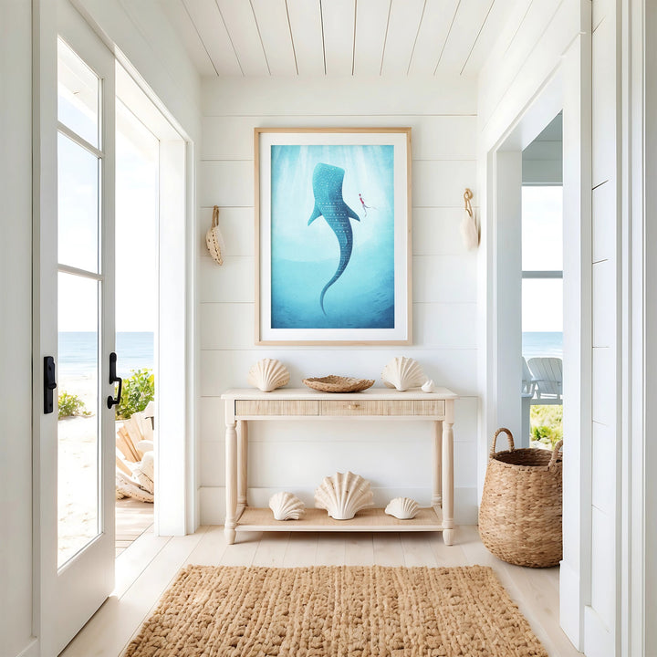 Artwork of a whale in a coastal room with shell decor and a view of the ocean.