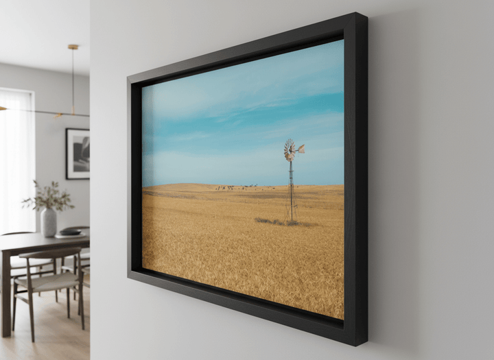Wall art styled above a dining table in a contemporary home
