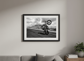 Modern wall art styled above a sofa in a neutral living room