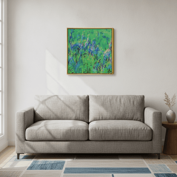 Canvas wall art with a gold leaf surround styled in a neutral living room
