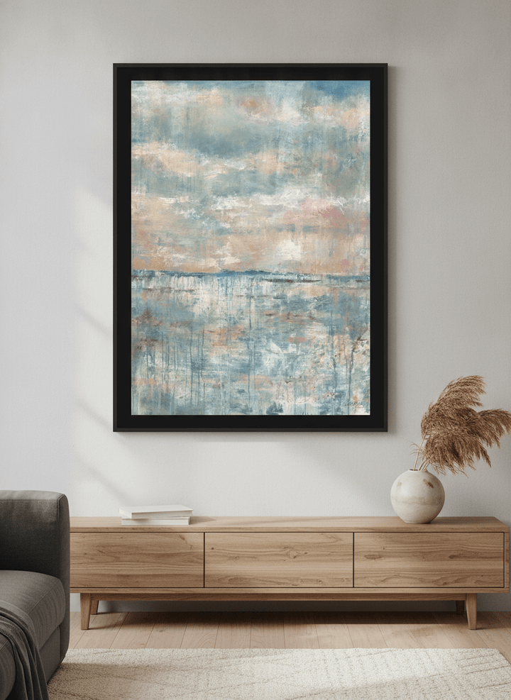 Modern wall art styled above a sofa in a neutral living room