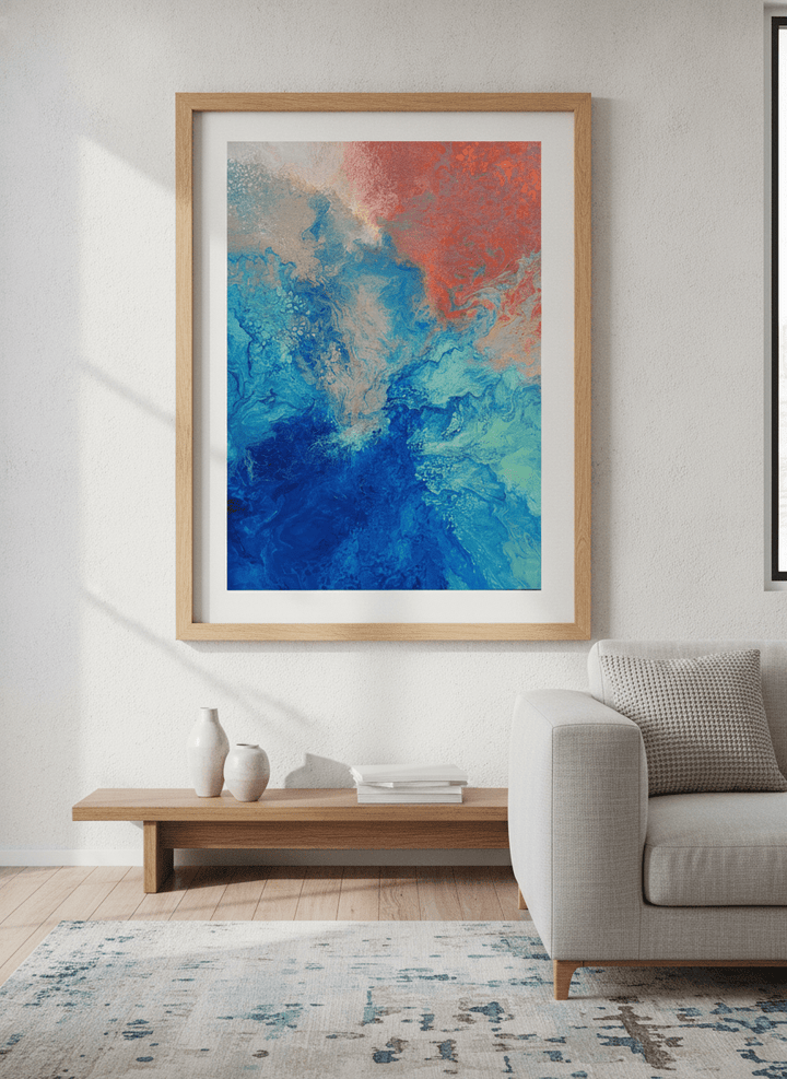 Modern wall art styled above a sofa in a neutral living room