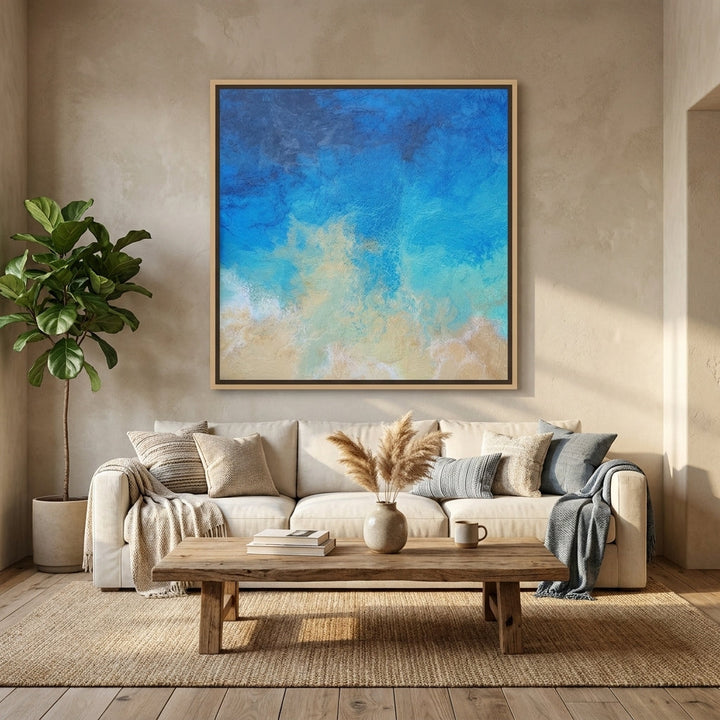 Oversized statement canvas wall art with a natural timber surround styled in a neutral living room