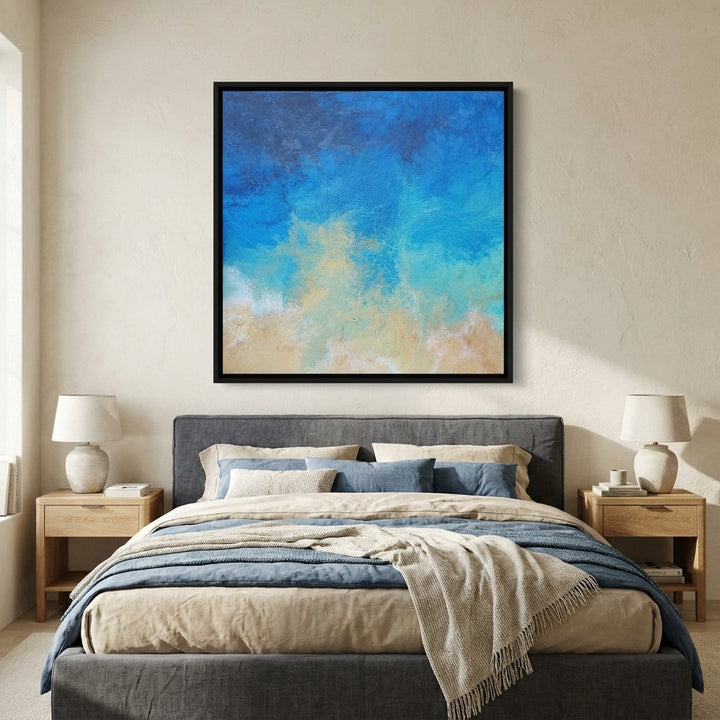 Canvas wall art with a black surround styled in a calm, light-filled bedroom
