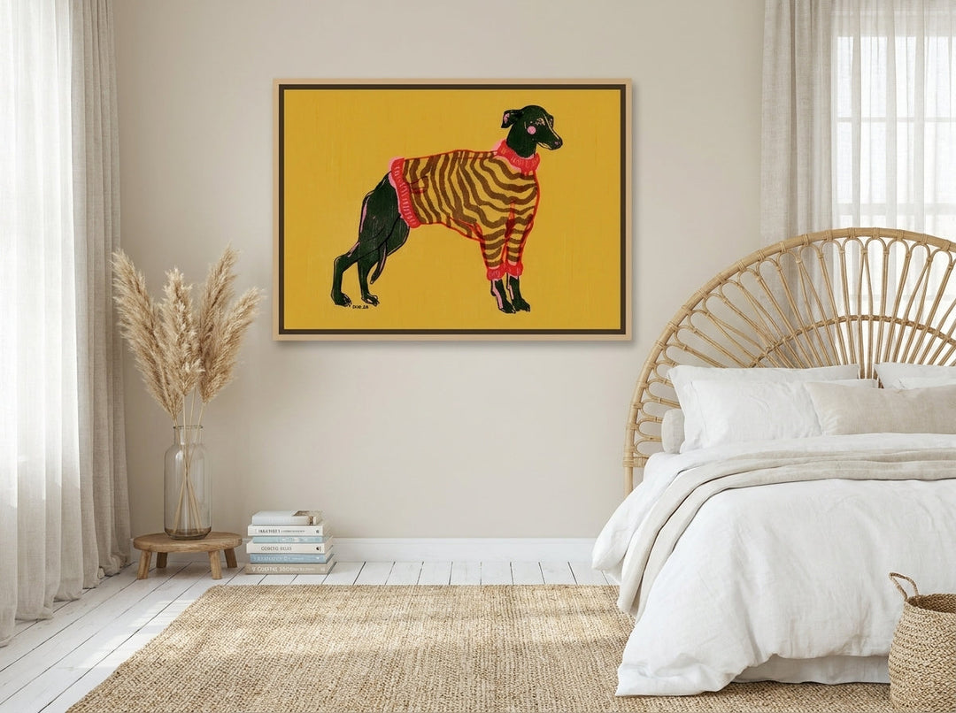 Canvas wall art with a natural timber surround styled on the wall in a coastal bedroom