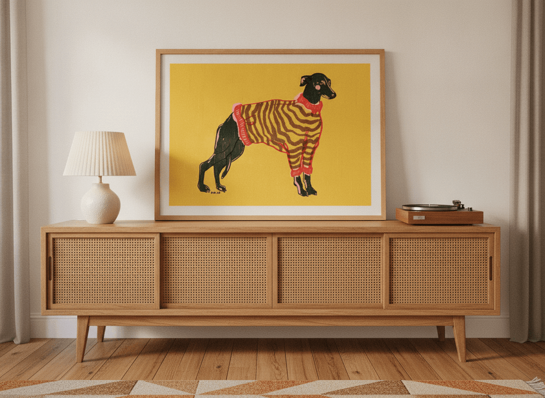 Modern wall art print standing on a sideboard in a mid-century home office